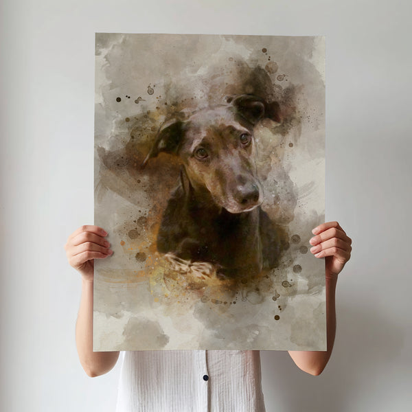 A person in a white shirt holds up a Watercolor Pet Portrait showing a black dog with a curious look on an abstract neutral background—a perfect pet lover gift.