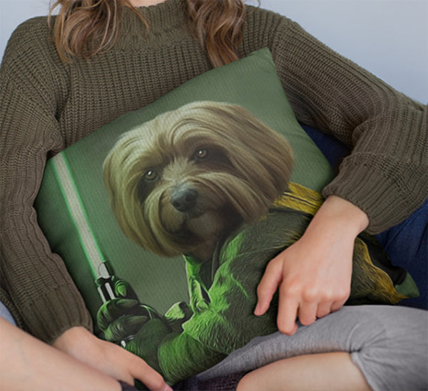 A person in a green sweater holds a Custom Star Wars Pet Cushion, showcasing an illustration of a dog as a Jedi with a green lightsaber.