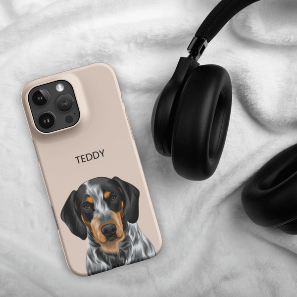A Custom Pet iPhone Case – Modern Vector Art with the name TEDDY and an illustrated dog sits by black headphones on a white blanket—a perfect gift for pet lovers.