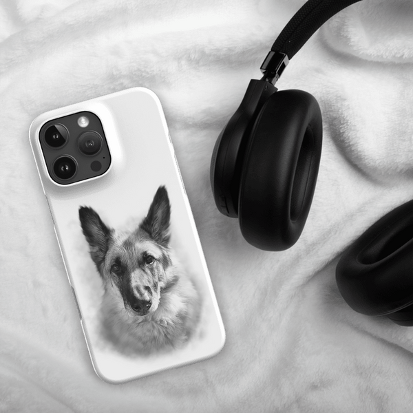 A Custom Pet iPhone Case – Digital Painting with a black and white dog image rests beside black over-ear headphones on a soft white fabric—a unique gift idea for pet lovers.
