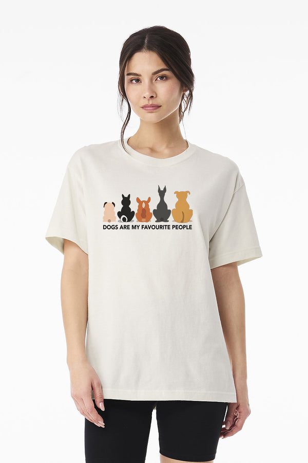 A woman wears the Dogs are my Favorite People vintage t-shirt, showcasing five colorful dog silhouettes—an ideal funny shirt and perfect gift for any pet lover.