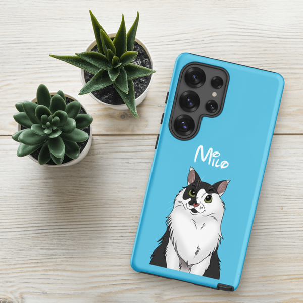 A Custom Pet Samsung Case – Disney featuring a cartoon of a black and white cat named “Milo” sits by two small potted succulents on light wood—a perfect, unique pet lover gift and keepsake.