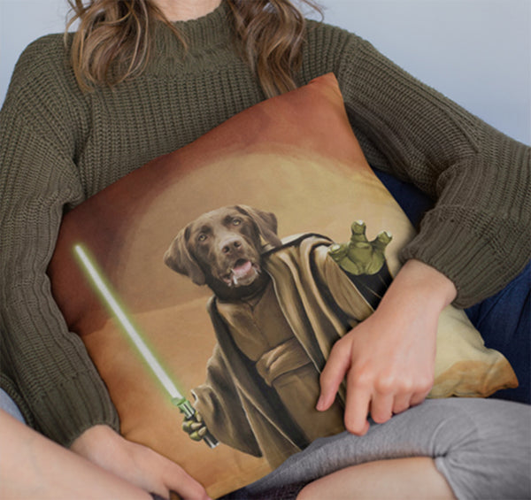 A woman in a green sweater holds a Custom Jedi Star wars Pet Cushion, showcasing a personalized dog illustration as a Jedi with robe, green lightsaber, and Yoda-like hand—a truly unique pet memorial gift.