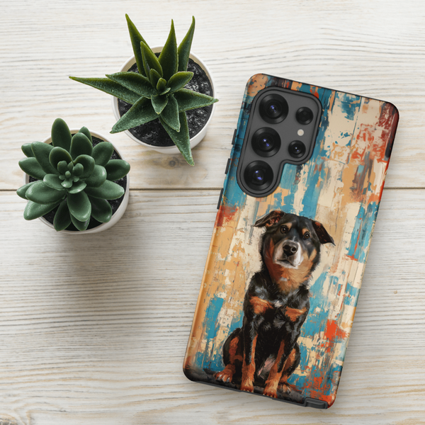 A Custom Pet Samsung Case – Abstract Design, featuring a painted black and brown dog, covers a smartphone resting on a light wooden surface beside two small potted succulents.