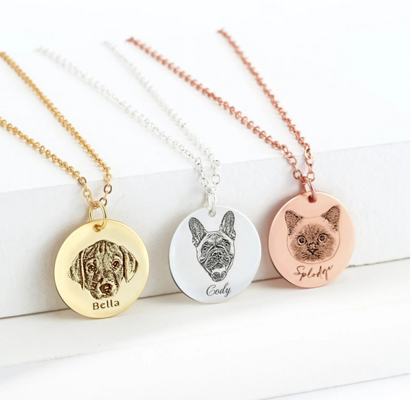 Three Dog Portrait Coin Necklaces: gold with dogs face labeled Bella, silver with dogs face labeled Cody, and rose gold memorial keepsake with cats face labeled Splody.