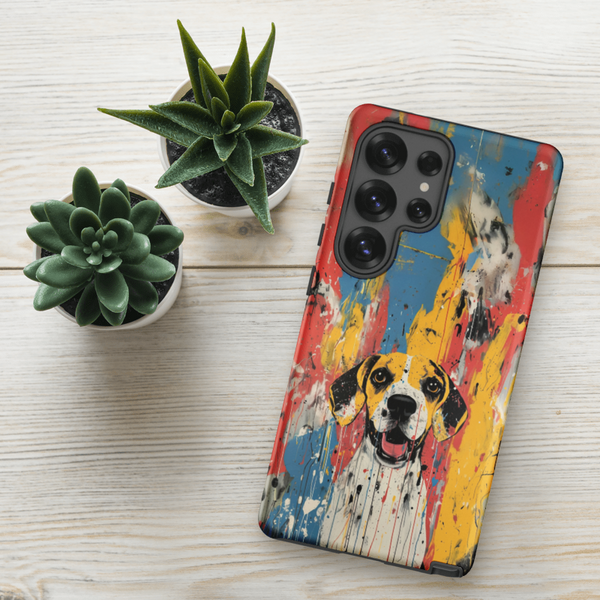 A Custom Pet Samsung Case – Abstract Design, featuring a colorful dog portrait, sits on a light wooden surface next to two small potted succulents.