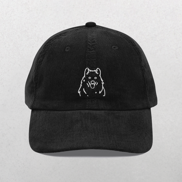The Custom Pet Line Art Portrait Corduroy Cap in Black features a white embroidered dog outline on the front. This unique textured hat is a perfect keepsake for any dog lover.