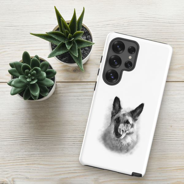 A Custom Pet Samsung Case – Digital Pet Painting with a black-and-white German Shepherd sketch rests on a light wooden surface beside two small potted succulents.