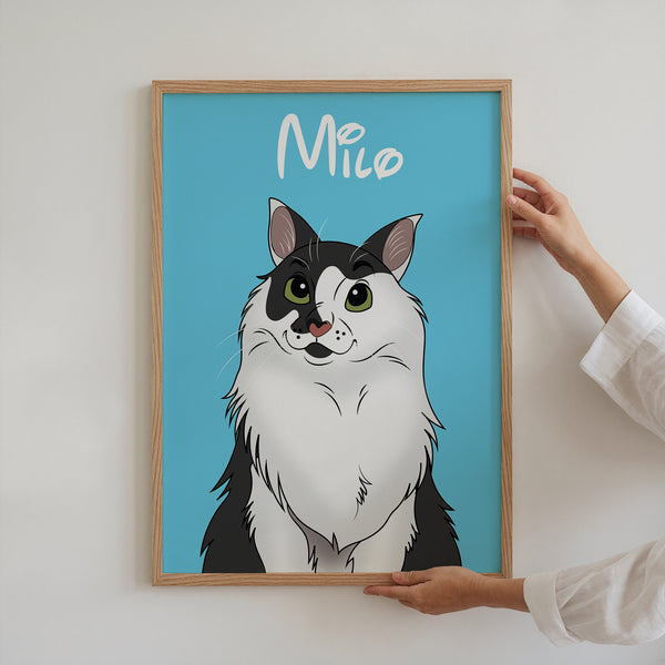 A person hangs a Disney Pet Portrait featuring a black and white cat named Milo with green eyes on a blue background. Milo is written in white script, making it an ideal gift for pet lovers or as unique pet memorial wall art.