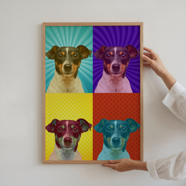 A person in a white sleeve holds the Warhole Custom Pop Art, a framed pet artwork featuring a dog in four vibrant quadrants with teal, purple, yellow, and red backgrounds.