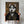 A person holds The General—a custom pet portrait featuring a husky in an ornate, vintage military uniform with gold embroidery on a brown background. The personalized dog canvas hides the persons face.