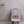 The Custom Cartoon Pet Cushion, featuring an illustrated dog and the name Max, sits on a chair against a light gray wall—an ideal cozy keepsake or unique pet memorial gift.
