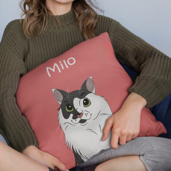 A woman in a green sweater holds a pink Custom Disney Pet Cushion featuring a cartoon cat and the name Milo—a perfect cozy keepsake for pet lovers.