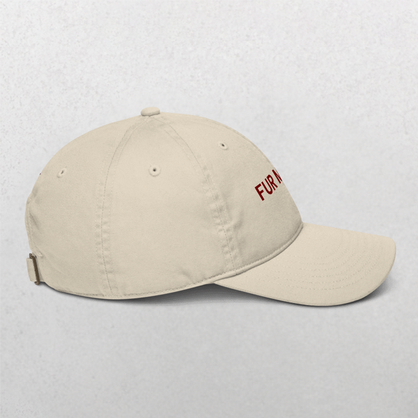 A side view shows the Classic Organic Dad Cap - Furr Mama in beige, with a curved brim, metal back adjuster, and partial red FUR M embroidery on the front.