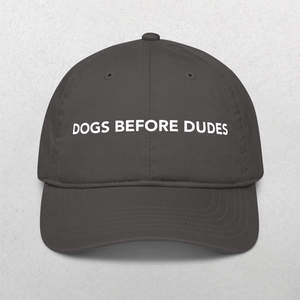 Show your canine pride with the Classic Organic Dad Cap in Charcoal, featuring DOGS BEFORE DUDES boldly on the front—a perfect hat for any dog lover.