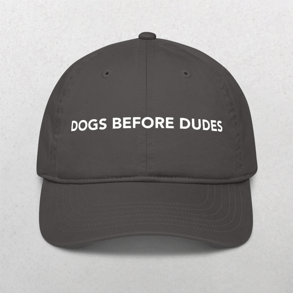 Show your canine pride with the Classic Organic Dad Cap in Charcoal, featuring DOGS BEFORE DUDES boldly on the front—a perfect hat for any dog lover.