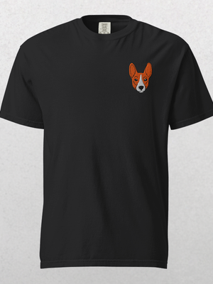 The Embroidered Pet Portrait Organic T-Shirt in black features a small orange and white dog face on the left chest—an ideal pet lover gift or unique keepsake, showcased against a light gray background.
