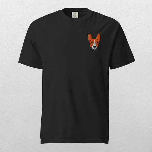 The Embroidered Pet Portrait Organic T-Shirt in black features a small orange and white dog face on the left chest—an ideal pet lover gift or unique keepsake, showcased against a light gray background.