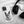 A Custom Pet iPhone Case – Digital Painting with a black and white dog image rests beside black over-ear headphones on a soft white fabric—a unique gift idea for pet lovers.