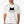 A man wears the Tiny Furry Overlord vintage white pet t-shirt with a black cat graphic and funny text—ideal for any proud pet lover.