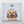 A cozy Custom Cartoon Pet Cushion in light blue, featuring a brown, fluffy dog with big eyes and floppy ears, personalized with the name Max in bold black letters above the illustration—perfect for any dog lover.