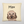 A beige Custom Cartoon Pet Cushion featuring a brown dog with floppy ears and Max above its head in bold black letters—a cozy keepsake and perfect gift for pet lovers.