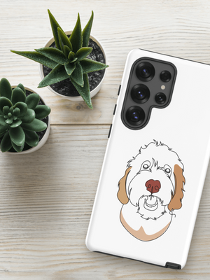A Custom Pet Samsung Case – Color Line Art, featuring a simple dog line drawing, rests on a light wooden surface beside two small potted succulents.