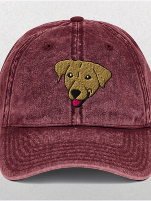 The Custom Pet Portrait Embroidered Vintage Cap is a maroon distressed cap featuring an embroidered brown dog’s head with its tongue out—a perfect personalized pet gift.