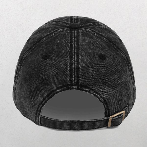 The Vintage Cap - Dogs Before Dudes is a black denim baseball cap with two back eyelets and an adjustable strap with metal buckle, perfect for dog lovers to show off their style and love for furry friends.