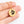 A hand holds the Dog Paw Necklace - Coin Necklace, featuring a round gold pendant with a black paw print—making it a perfect personalized pet jewelry piece and thoughtful gift for pet lovers, displayed on a plain white background.