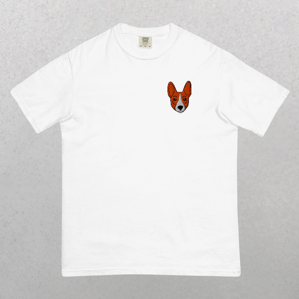Embroidered Pet Portrait Organic T-Shirt in white features a small embroidered corgi dog face on the left chest, shown against a light gray textured background—the ideal unique keepsake or funny pet shirt for animal lovers.