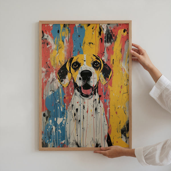 A person hangs the Abstract Masterpiece - Custom Pet Portrait, featuring a happy dog with floppy ears and vibrant blue, yellow, red, and black splashes on a white wall—a perfect gift for pet lovers.