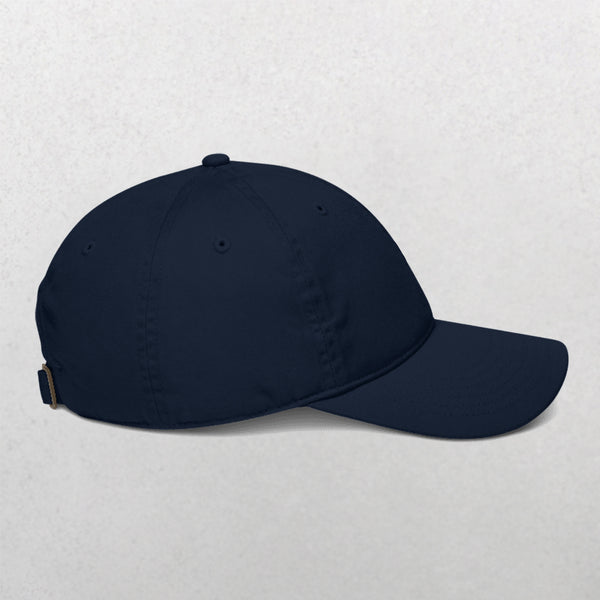 An Embroidered Line Art Pet Portrait Organic Classic Dad Cap in black, viewed from the side on a light grey background—ideal for creating custom pet caps or giving as a unique personalized pet gift.