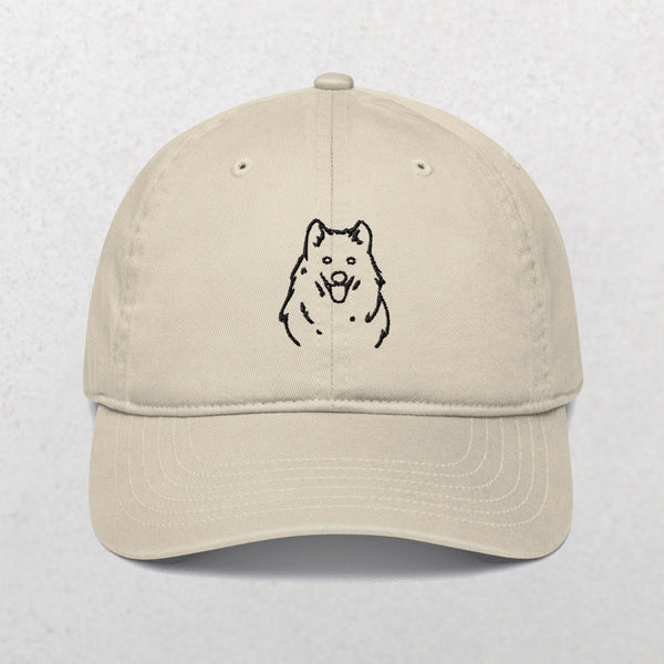 The Embroidered Line art Pet Portrait Organic Classic Dad Cap in oyster features a simple dogs face outline on the front—perfect as a personalized pet gift.