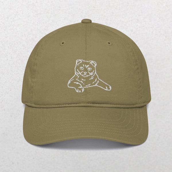 The Embroidered Line Art Pet Portrait Organic Classic Dad Cap in olive green features a white line drawing of a cat with folded ears and outstretched paws on the front—a unique pet keepsake. Background is light grey.
