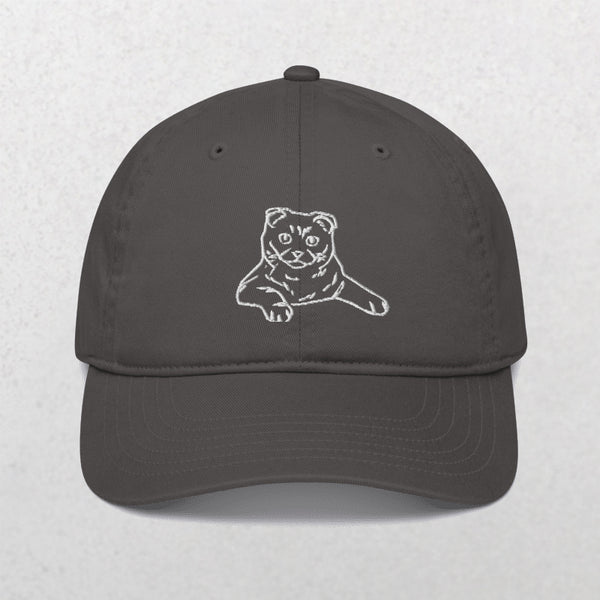 The Embroidered Line art Pet Portrait Organic Classic Dad Cap is a dark gray custom hat with a simple white line drawing of a three-eyed cat embroidered on the front—an ideal personalized pet gift for animal lovers.