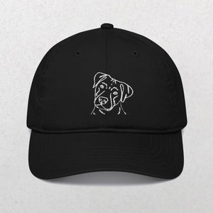 Embroidered Line art Pet Portrait Organic Classic Dad Cap in black features a simple white line dog head design on the front—an ideal unique pet keepsake, shown against a plain light background.