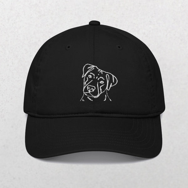 Embroidered Line art Pet Portrait Organic Classic Dad Cap in black features a simple white line dog head design on the front—an ideal unique pet keepsake, shown against a plain light background.