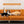 A vibrant orange couch displays four Custom Ugly Shape Pet Pillows, each resembling different animals. Above is a sign: CUSTOM UGLY PET CUSHION. These quirky pillows make a unique pet memorial gift for animal lovers.
