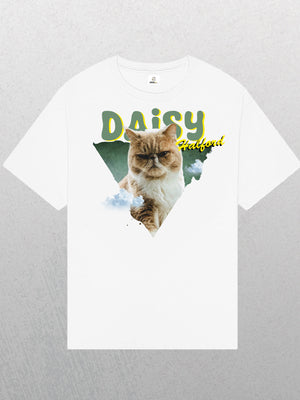 White Personalised Retro Tee | Green featuring a grumpy light brown cat in front of a green triangle, “DAISY” in yellow, “halboui” above the cat, with cloud details—a unique vintage-style white tee for pet lovers.