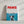The Paws Film Cover is a canvas print parodying the Jaws poster, showing a happy dog underwater beneath a swimmer. PAWS appears in bold red, creating a unique custom pet portrait—an ideal gift for pet lovers.