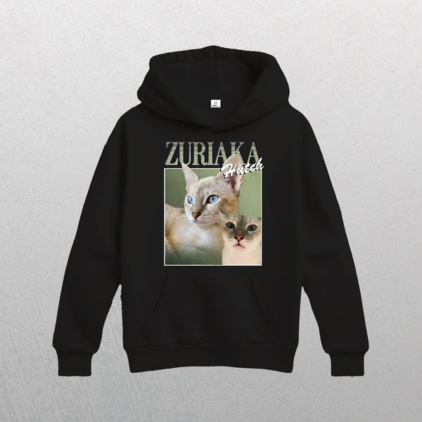 Black Personalised Homage Hoodie | Jungle featuring a graphic of two blue-eyed cats (one large, one small) and ZURIAKA with Hutch above them on a light gradient background. Made from premium fleece.