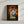 The Jurassic Bark Pet Portrait features a movie poster-style artwork of a white dog with blue eyes before an orange sunset and jungle, with the Jurassic Park logo above and KURAMA in bold yellow—perfect for pet lovers or as a custom canvas gift.