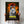 A person holds the Jurassic Bark Pet Portrait, a parody poster featuring Kurama, a white dog replacing a dinosaur against a jungle sunset with the classic logo—fun pet artwork ideal for any pet memorial wall art collection.