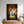 A poster features the Jurassic Bark Pet Portrait: a white wolf with blue eyes before a sunset and jungle, styled like the Jurassic Park logo with “Kurama” in bold yellow. Below, potted plants sit on a table—great for pet portrait fans.