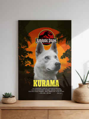 A poster features the Jurassic Bark Pet Portrait: a white wolf with blue eyes before a sunset and jungle, styled like the Jurassic Park logo with “Kurama” in bold yellow. Below, potted plants sit on a table—great for pet portrait fans.