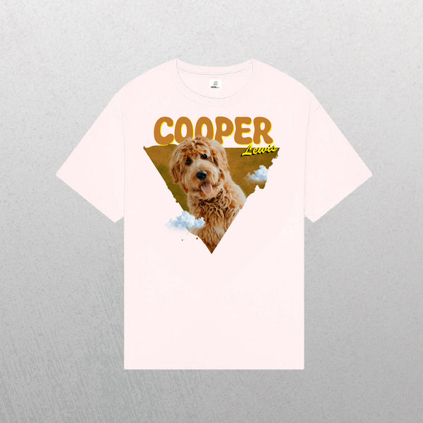 A light pink Personalised Retro Tee | Orange displays a photo of a brown, curly-haired dog in a triangle with clouds and bold yellow COOPER and Lewis text—making it an ideal pet lover gift.