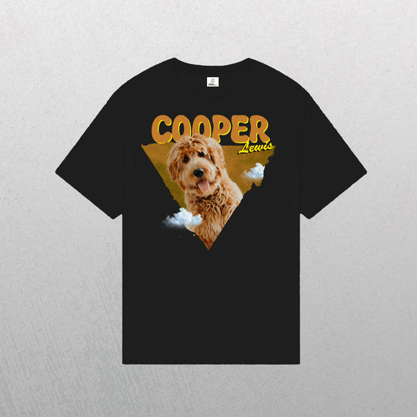 The Personalised Retro Tee | Orange is a black t-shirt featuring a photo of a brown, curly-haired dog with clouds, COOPER in bold yellow and Lewis in script—an ideal custom shirt for any pet lover.