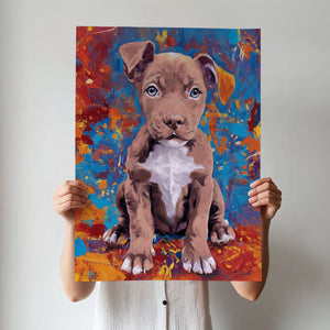 A person in a white shirt holds the Oil Masterpiece - Custom Pet Portrait, featuring a painted brown and white puppy against vibrant blue, orange, and red splashes. Their face is hidden behind this unique pet artwork.