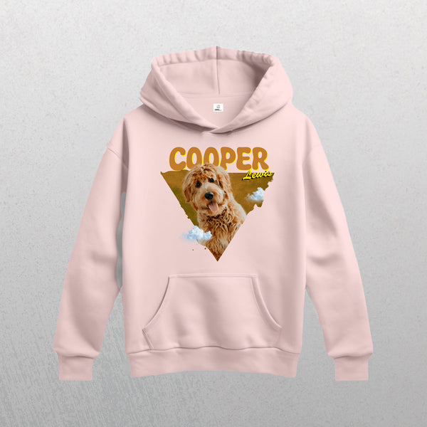 A light pink Personalised Retro Hoodie | Orange featuring a graphic of a fluffy brown dog in a triangle with clouds, plus the text COOPER and Lover—perfect as a custom pet hoodie for any dog lover.